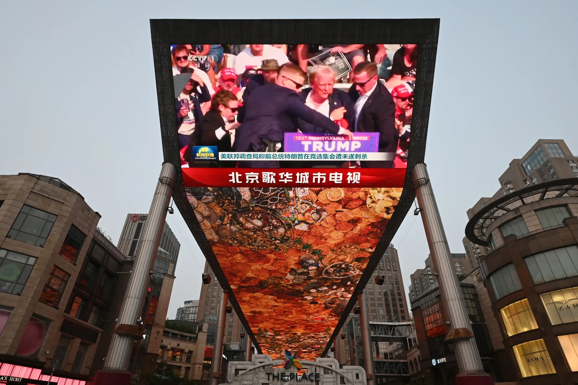 News of&nbsp;the assassination attempt on&nbsp;Donald Trump shown on a screen in Beijing on July 14.