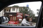 A motorcyclist passes the Mainland hospital in the Yaba area of Lagos, Nigeria.