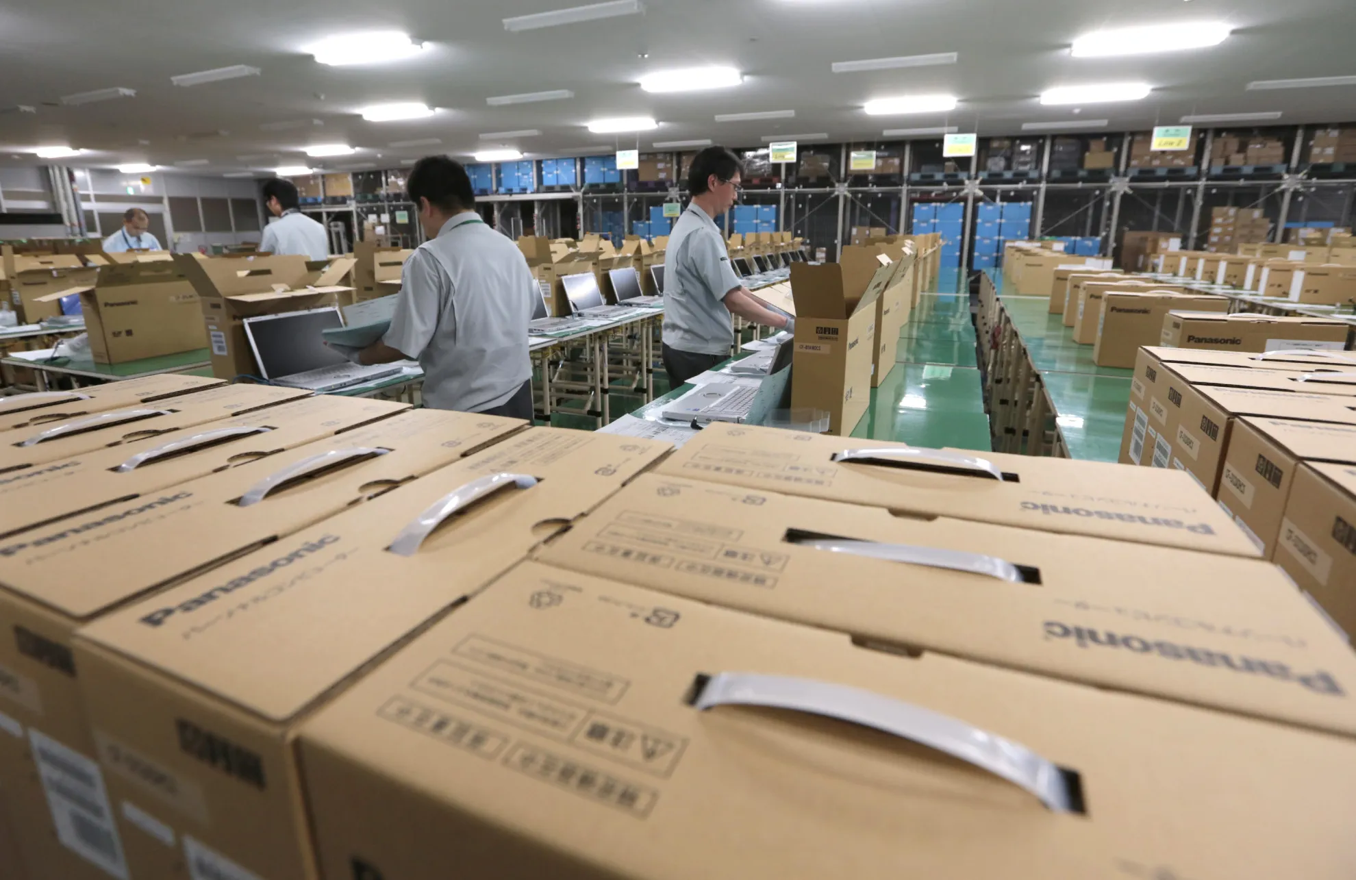 Workers box Panasonic Corp.&nbsp;laptop computers in Kobe City,&nbsp;Japan.