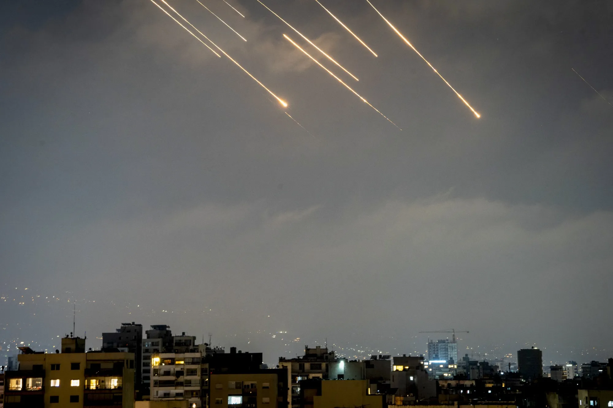 Iranian missiles and Israeli interceptors light up the sky over Beirut on June 14.