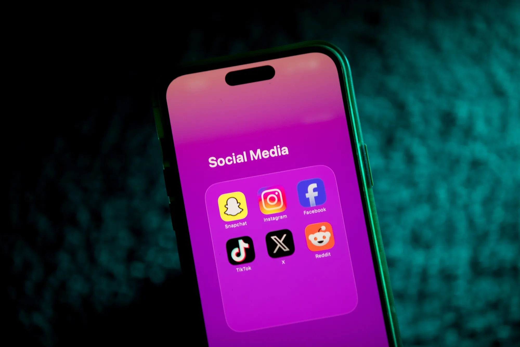 Social media app icons on a smartphone.