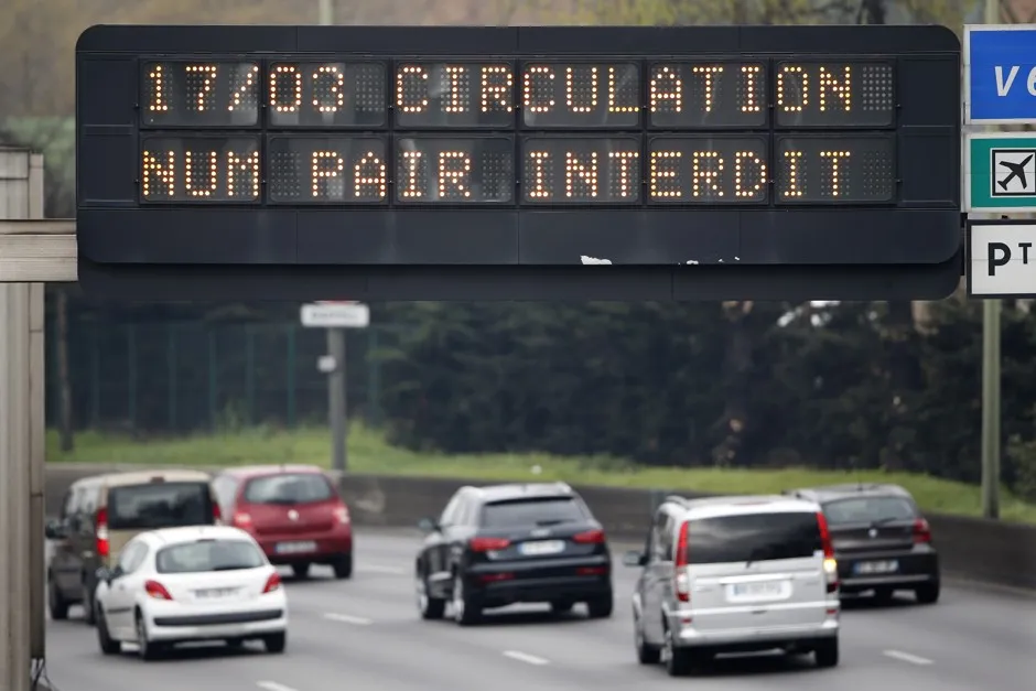An electronic road sign reads "Road traffic forbidden for even-numbered license plates" on the Paris ring road March 17, 2014. 