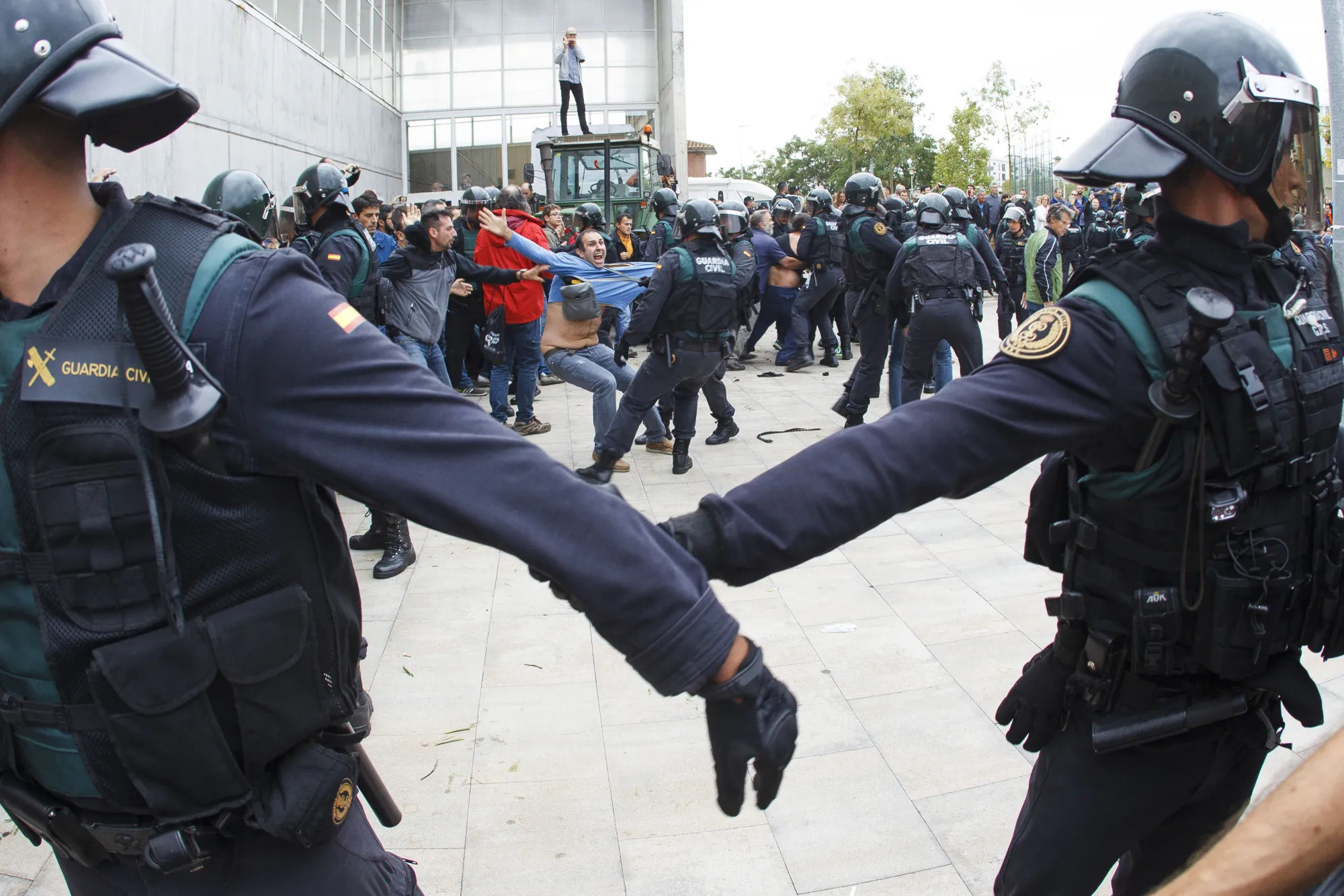 Civil Guard officers clash with members of the public outside a polling station used for the banned referendum, in Sant Julia de Ramis, Spain, on Oct. 1.
