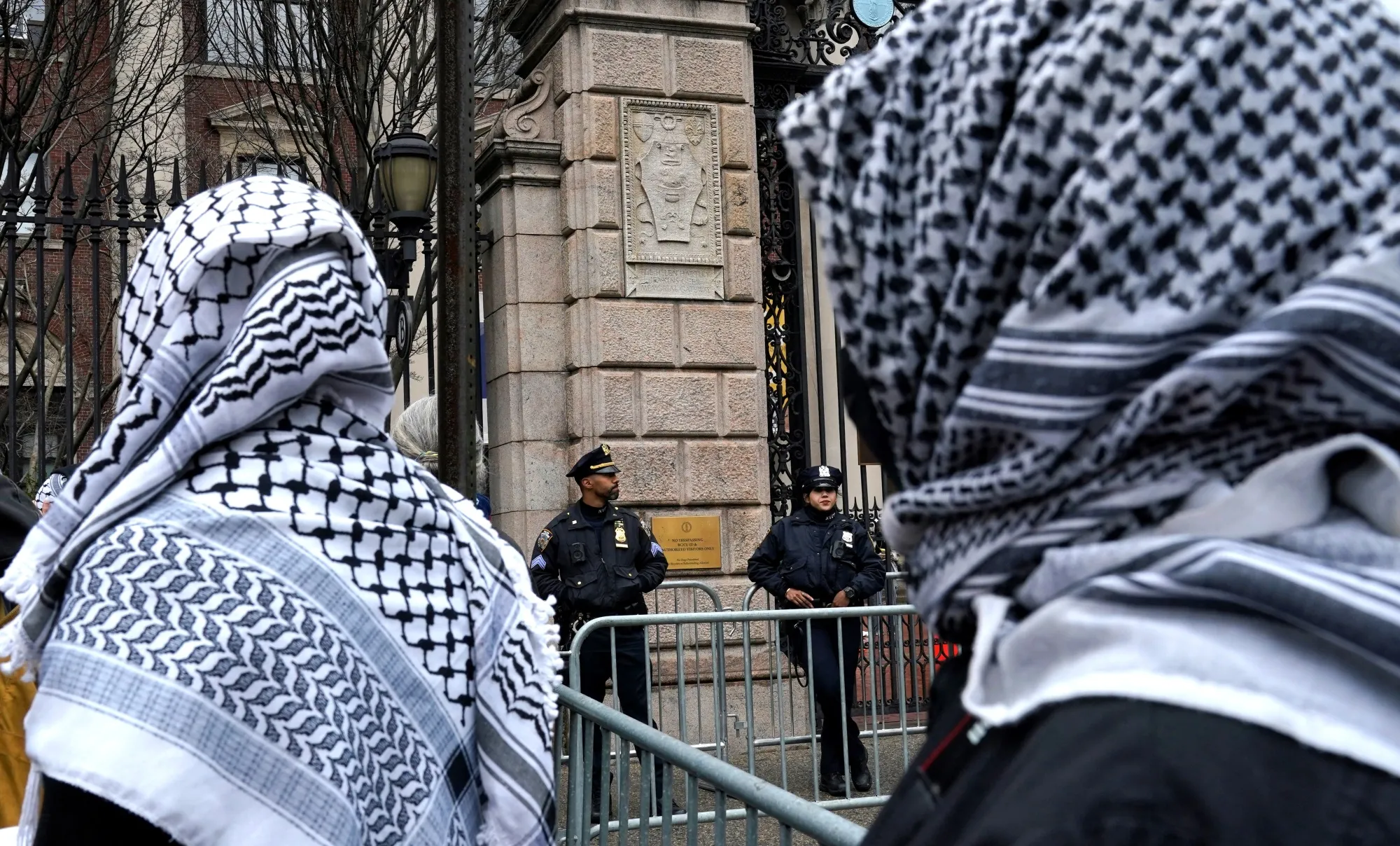 Student protesters face police as they demonstrate outside Barnard College in New York, on Feb. 27.&nbsp;
