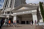 Tourists walk towards the entrance to the Caesars Palace hotel in Las Vegas, Nevada.