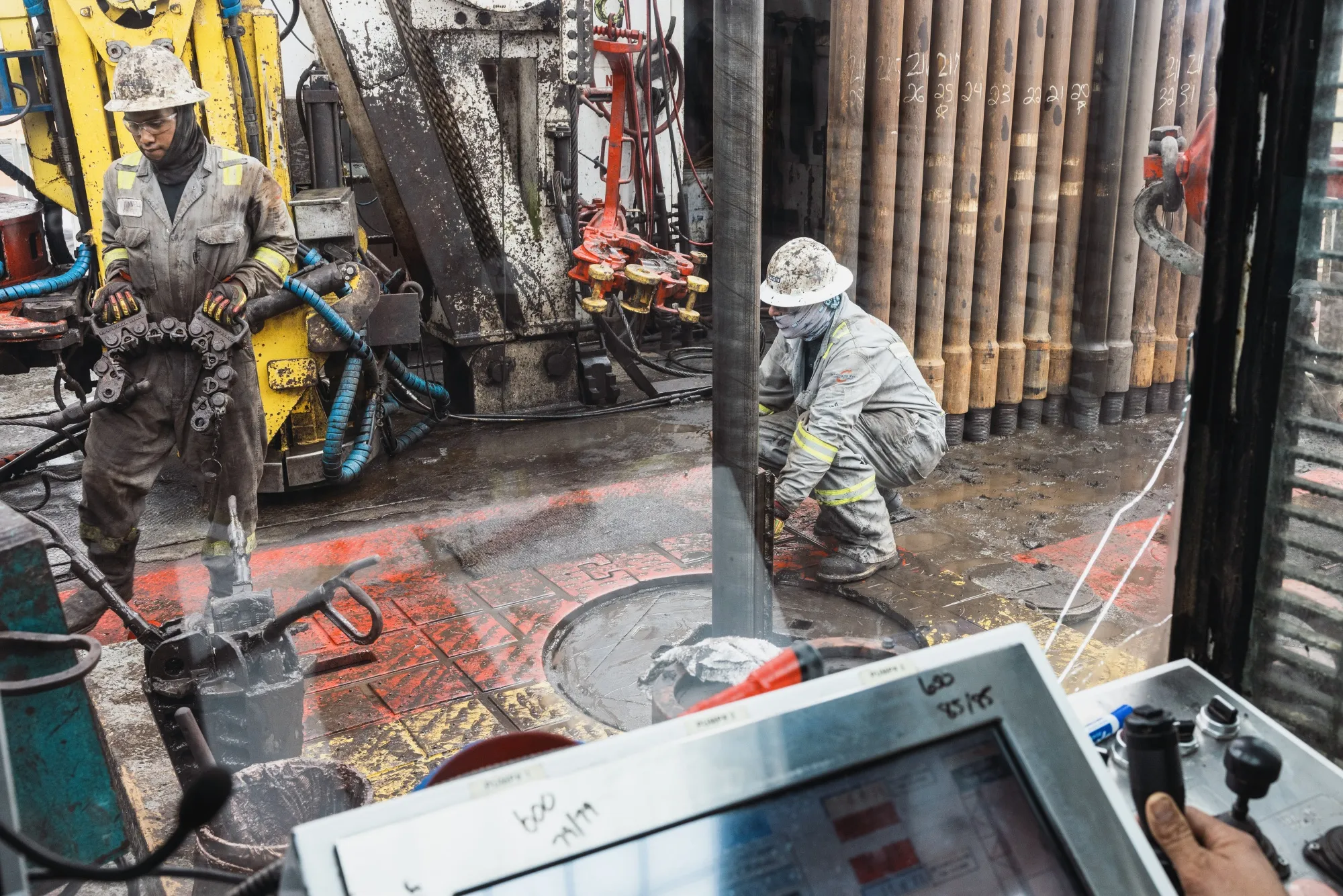 Workers drill for oil on the land&nbsp;in Andrews, Texas.
