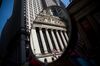 The New York Stock Exchange (NYSE) is reflected in a mirror in New York, U.S., on Friday, June 17, 2016. U.S. stocks retreated, resuming a drop that has sent them lower in six of the last seven days, amid selling in health-care and technology shares that have been the market's weakest all year.