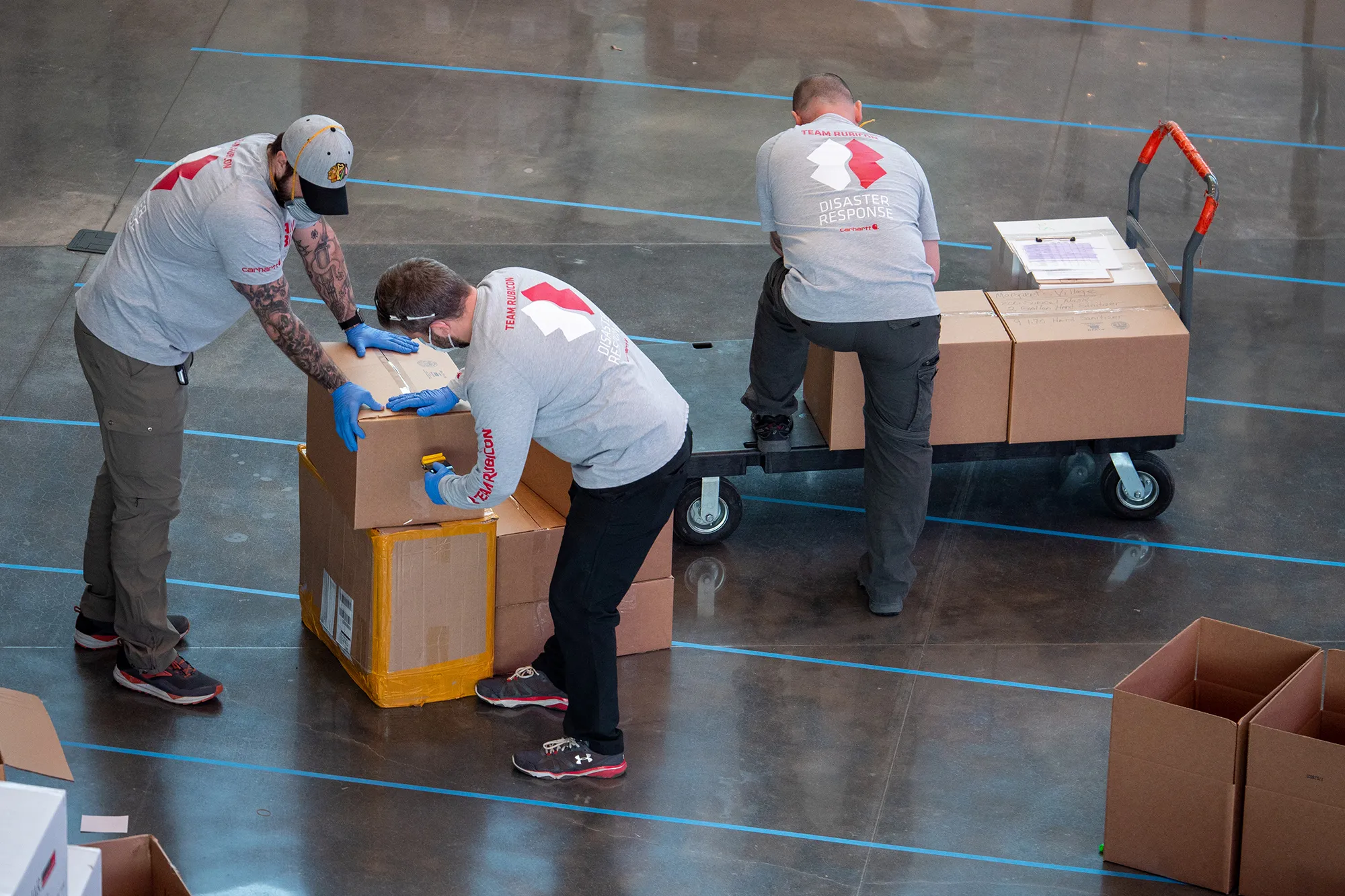 Team Rubicon volunteers sort through donated personal protective equipment in Chicago.