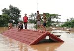 Villagers take refuge from floodwater in Laos.