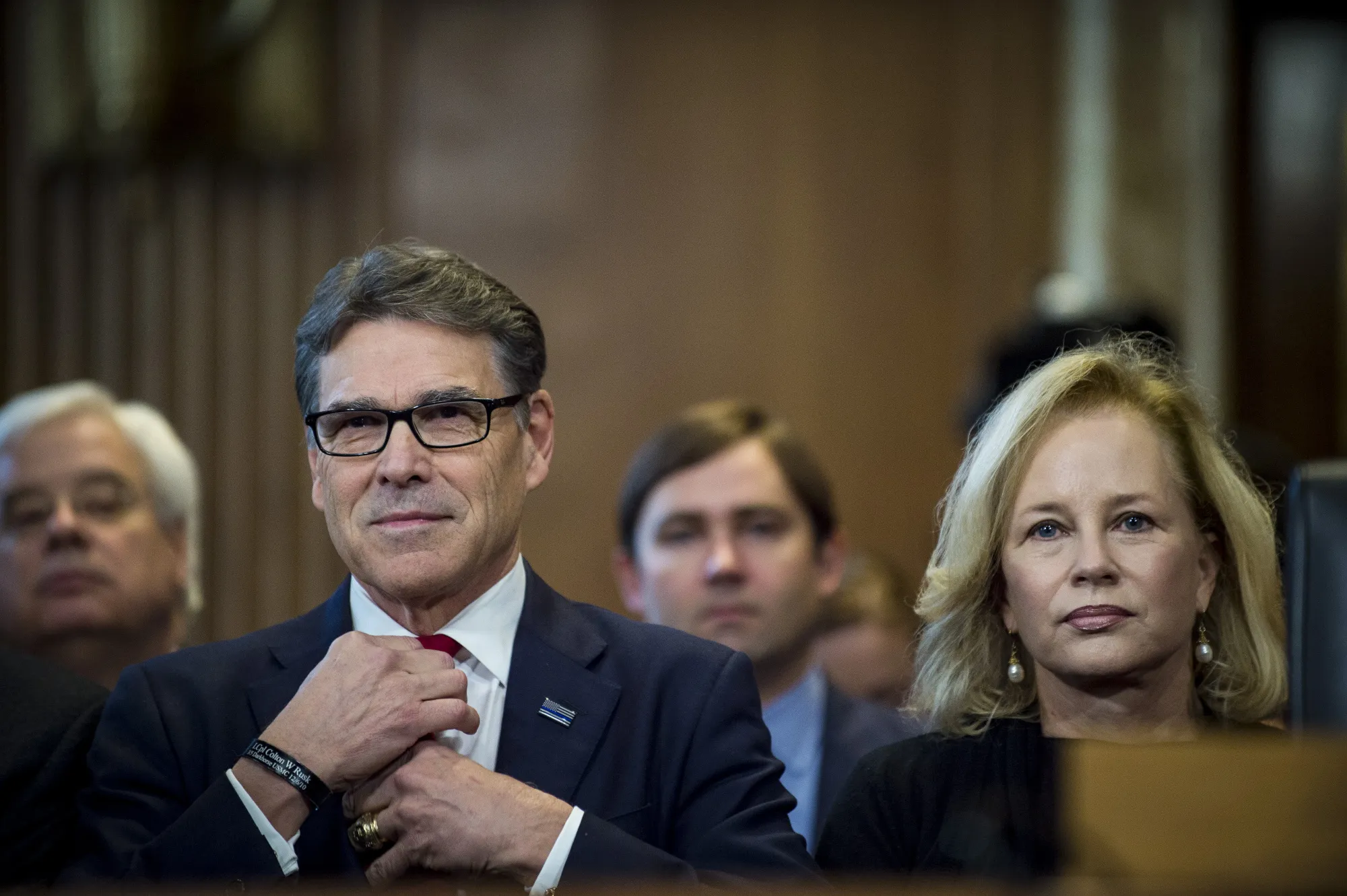 Rick Perry, former governor of Texas, sits with his wife Anita Thigpen Perry before the start of a Senate hearing in Washington on Jan. 19, 2017.