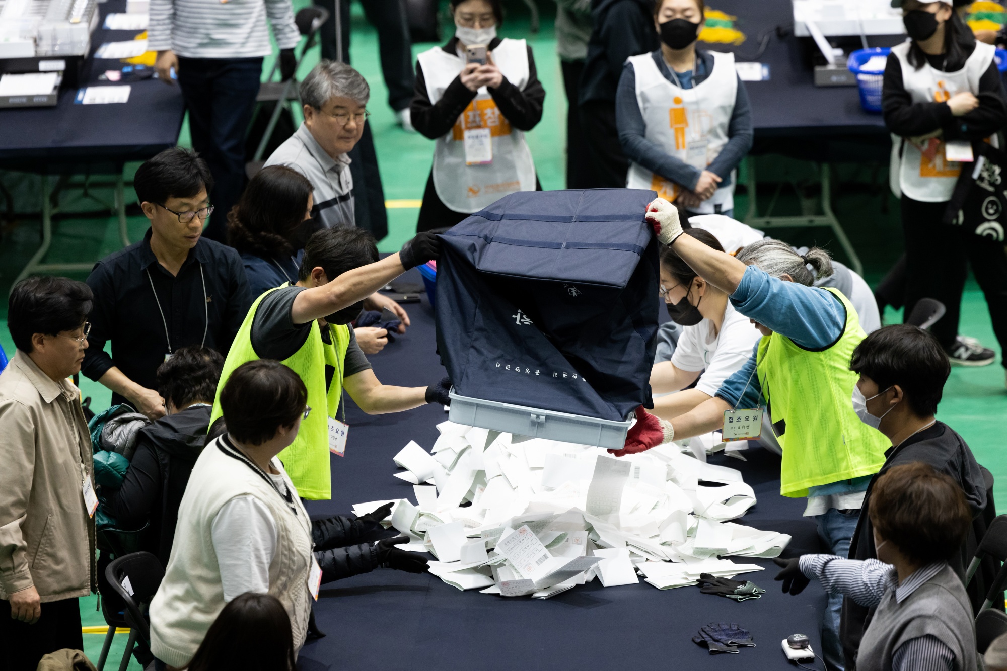 Officials count ballots following a parliamentary election on April 10.