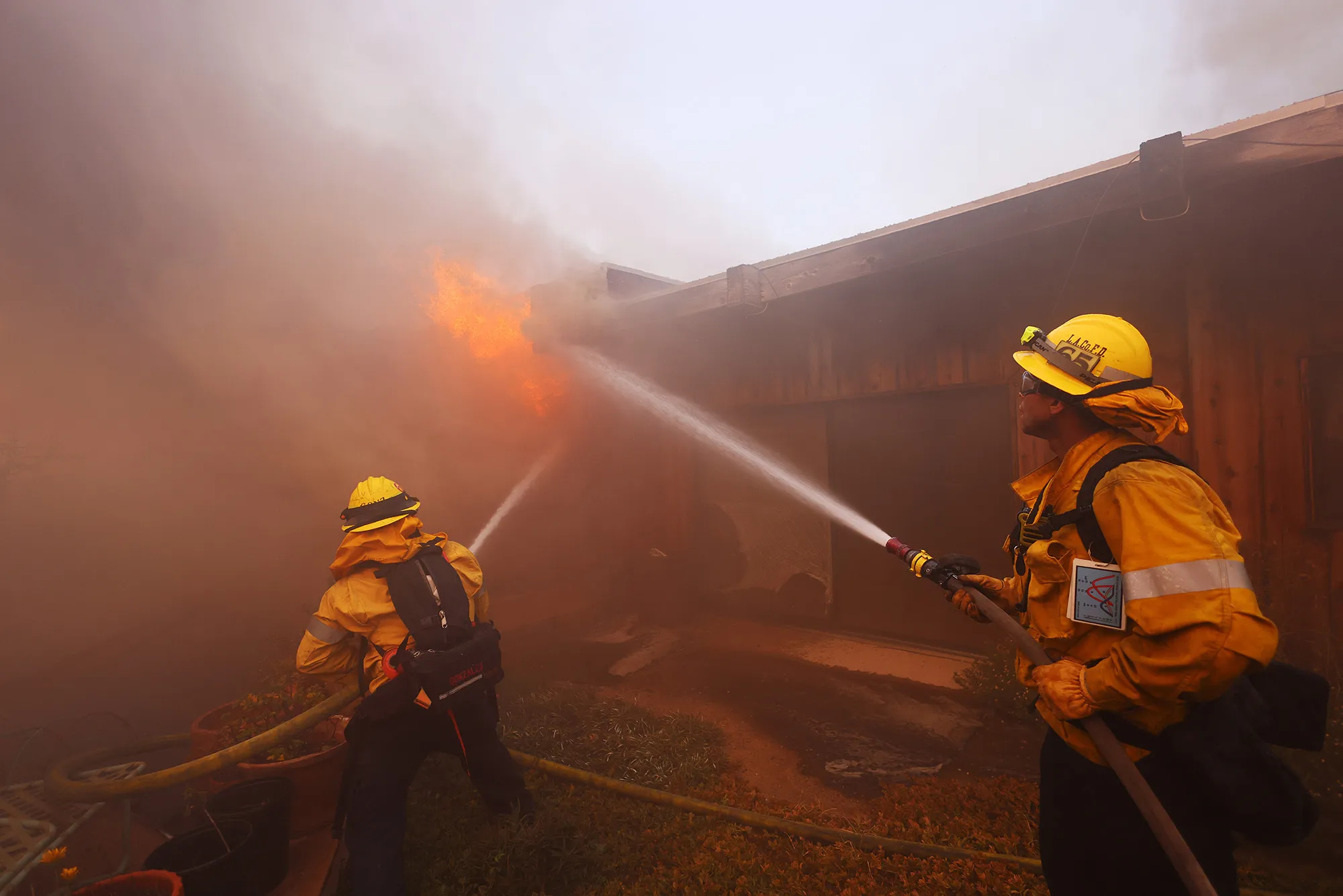 Firefighters battle flames from the Palisades Fire in the Pacific Palisades neighborhood of Los Angeles, on Jan. 7.