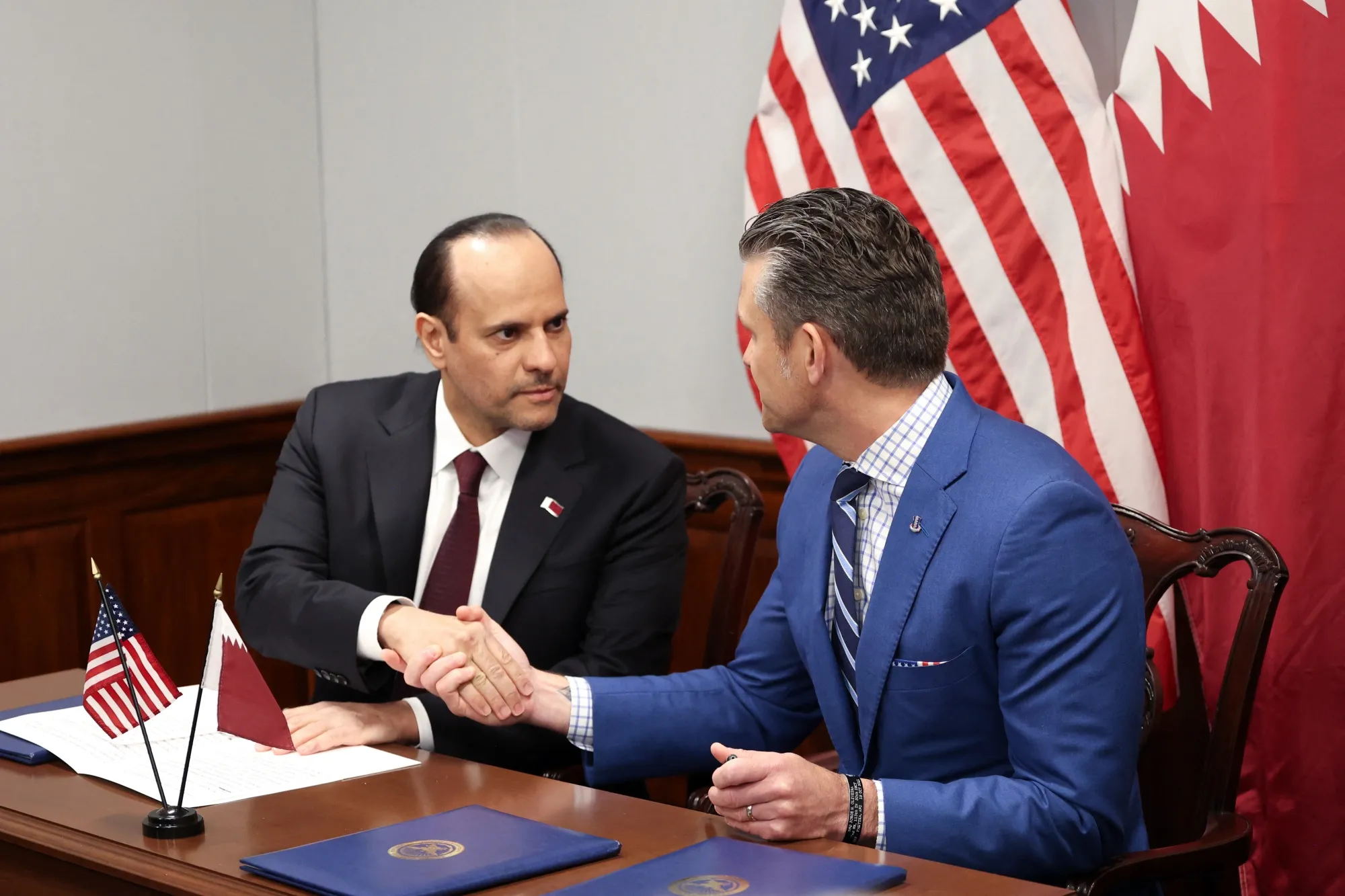 Qatari Defense Minister Sheikh Saoud bin Abdulrahman Al Thani and US Defense Secretary Pete Hegseth&nbsp;shake hands after signing a letter of acceptance to establish a Qatari Emiri Air Force training facility at the Mountain Home Air Force Base in Idaho, at the Pentagon in Arlington, Virginia, on Oct. 10.