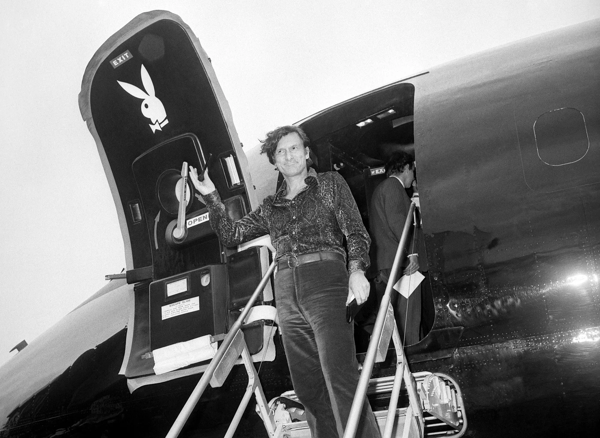 Hugh Hefner steps from the all-black “Big Bunny” jet, in London in 1971.