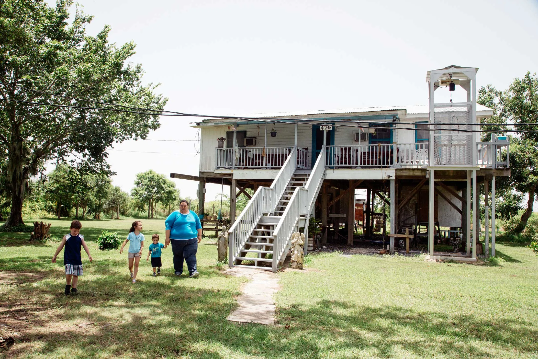 Chantelle Comardelle and her children on Isle de Jean Charles, Louisiana, the first community in the U.S. to get federal funding to relocate because of climate change.
