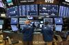 Traders work on the floor of the New York Stock Exchange (NYSE) in New York, U.S., on Friday, Feb 23, 2018.