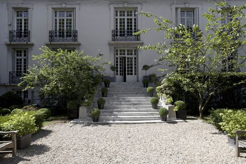 Steps leading up to the Directoire-style facade.