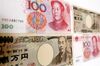 Chinese renminbi and Japanese yen bank notes are arranged for a photograph in Beijing, China, on Thursday, May 31, 2012. China and Japan have agreed to commence direct foreign exchange transactions of yuan and yen in Shanghai and Tokyo beginning June 1.