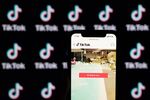 The website for ByteDance Ltd.'s TikTok app is displayed on a smartphone in an arranged photograph in Beijing, China, on Wednesday, Sept. 2, 2020. U.S. President Donald Trump said he's told people involved in the sale of the U.S. assets of ByteDance's TikTok that the deal must be struck by Sept. 15 and the federal government must be "well compensated," or the service will be shut down.