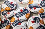 Buttons that read &quot;I got Vaccinated at Fenway Park&quot; are distributed at a mass Covid-19 vaccination site at Fenway Park in Boston in January.&nbsp;