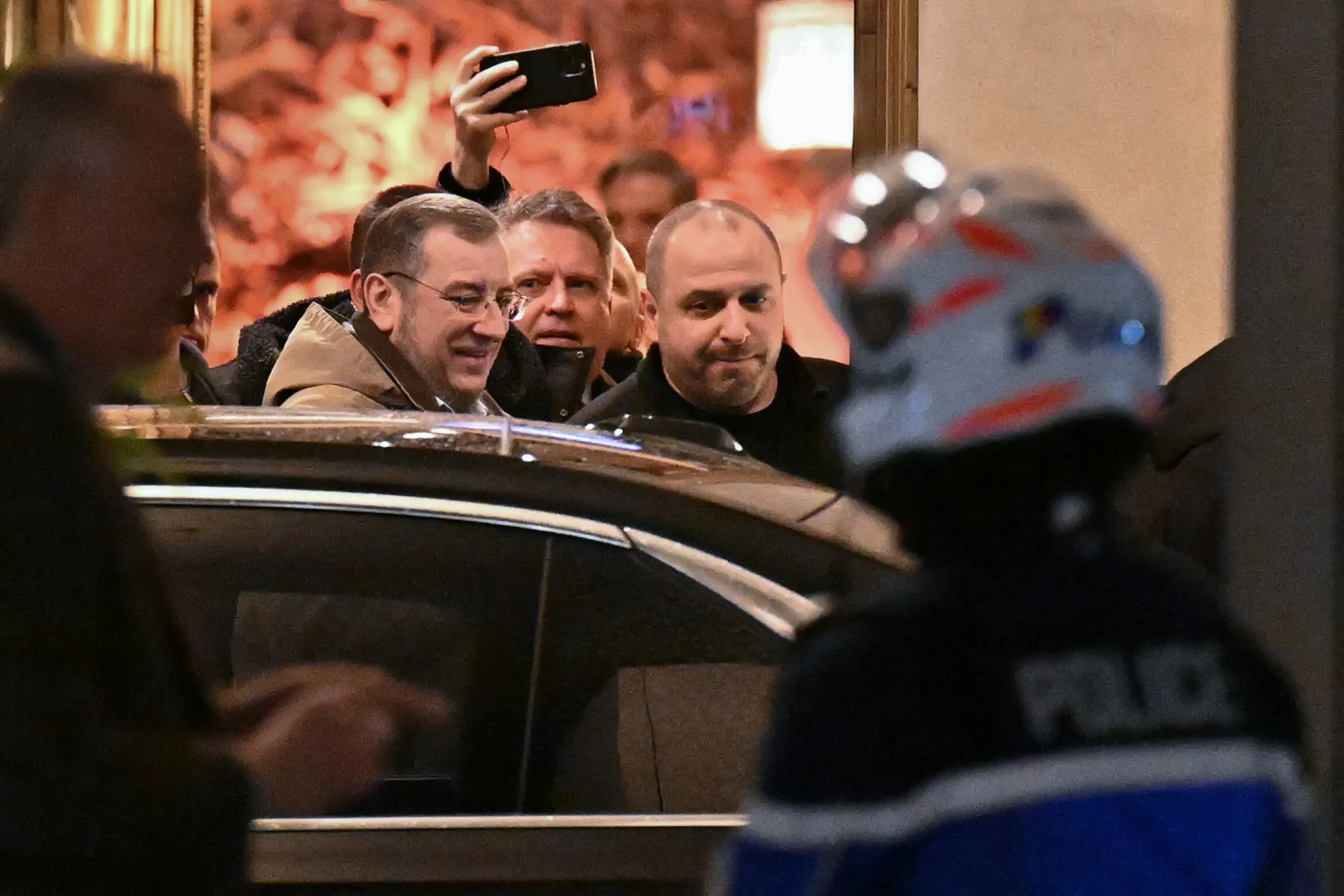 Ukrainian National Security and Defense Council Secretary Rustem Umerov, right, leaves the Intercontinental hotel during talks in Geneva, on Feb. 17.