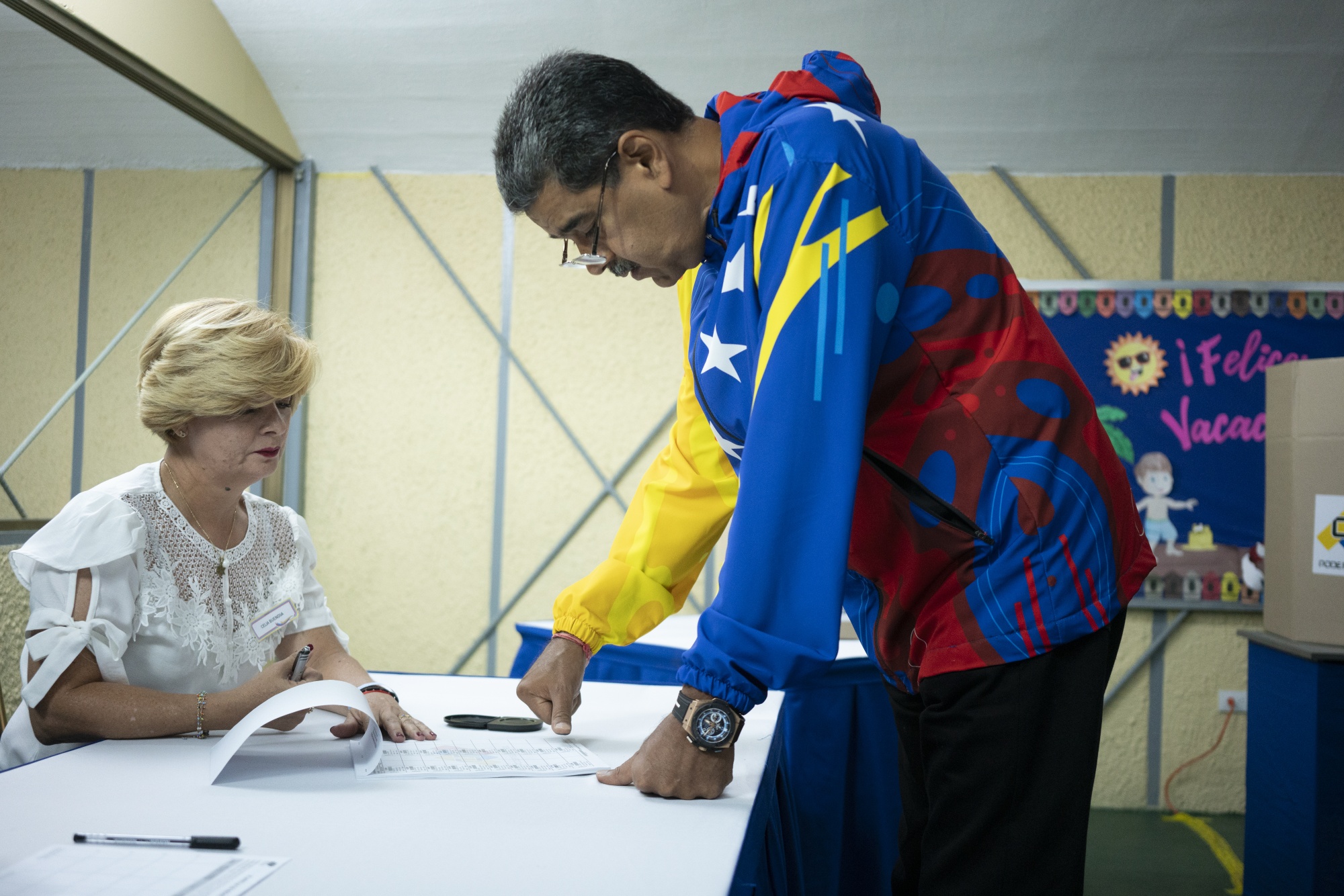 Nicolas Maduro presses his thumbprint after casting a ballot at a polling station during the presidential election in Caracas, Venezuela on July 28.