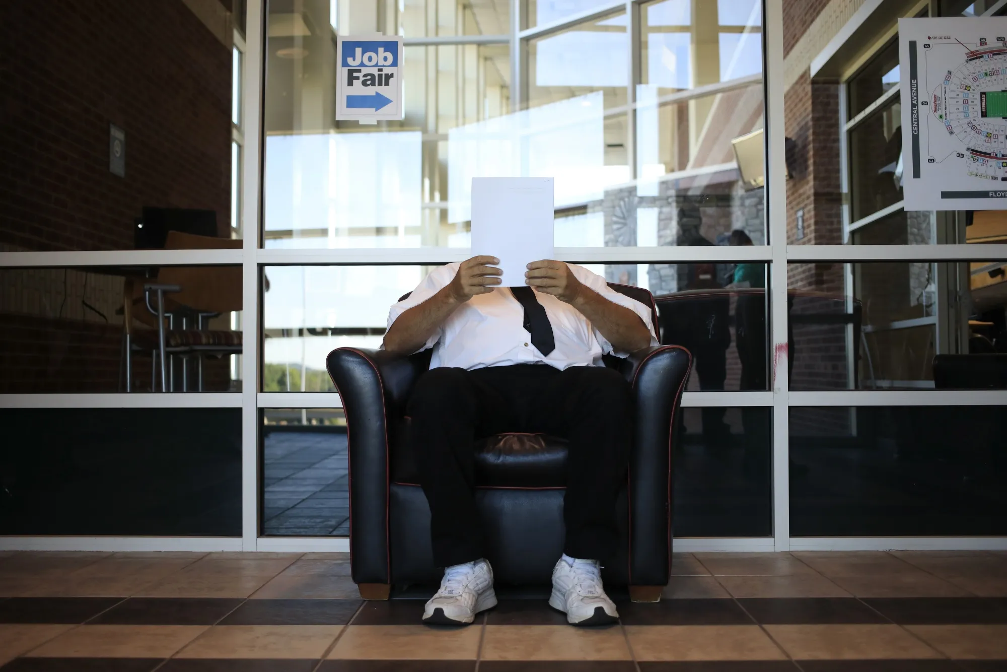 A job seeker reads paperwork during a Job News USA career fair in Louisville, Kentucky, U.S., on June 23.