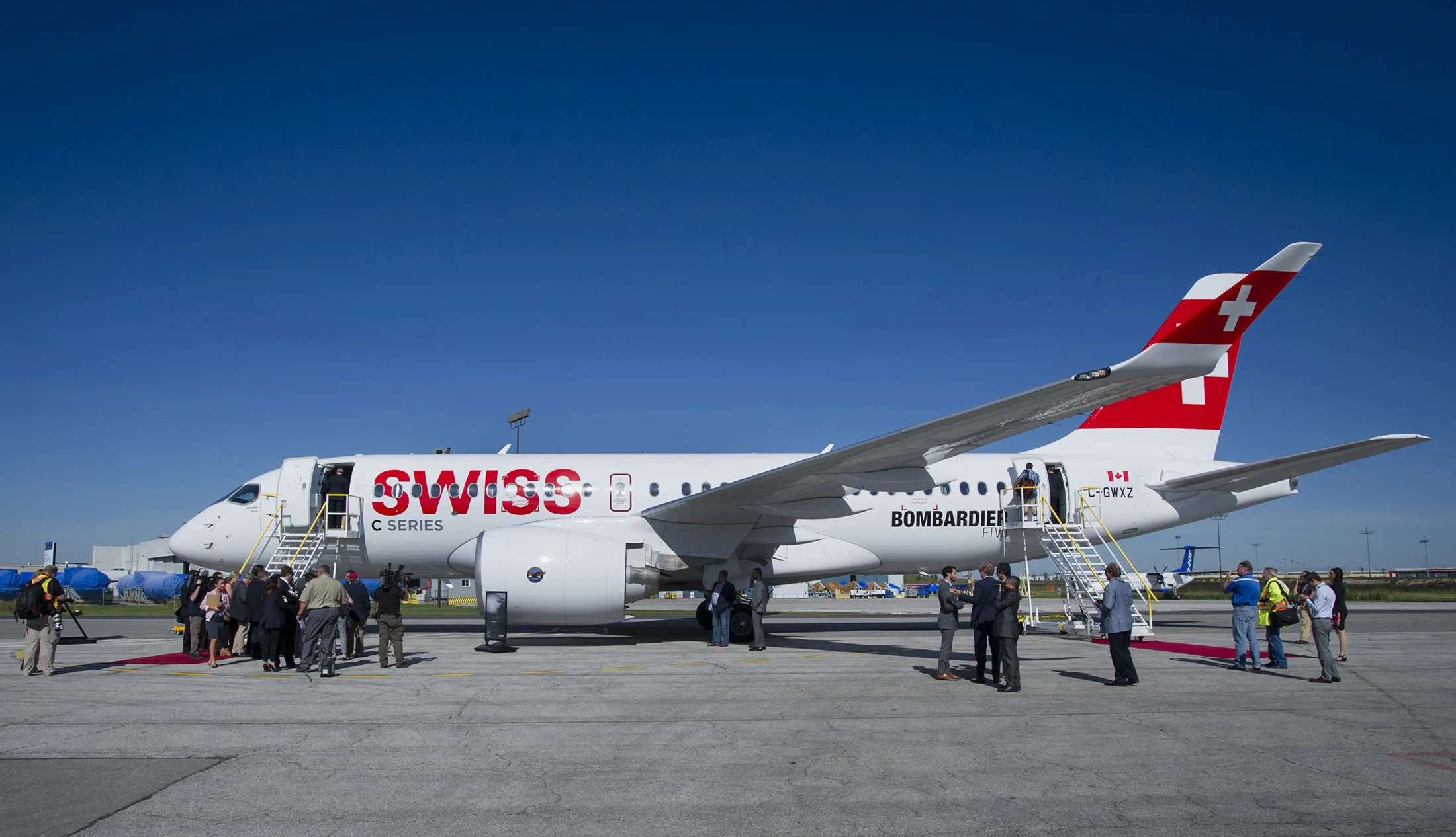 Attendees view the new Bombardier Inc. CS100 airplane during an event at the company's facility in Toronto on Sept. 10, 2015.
