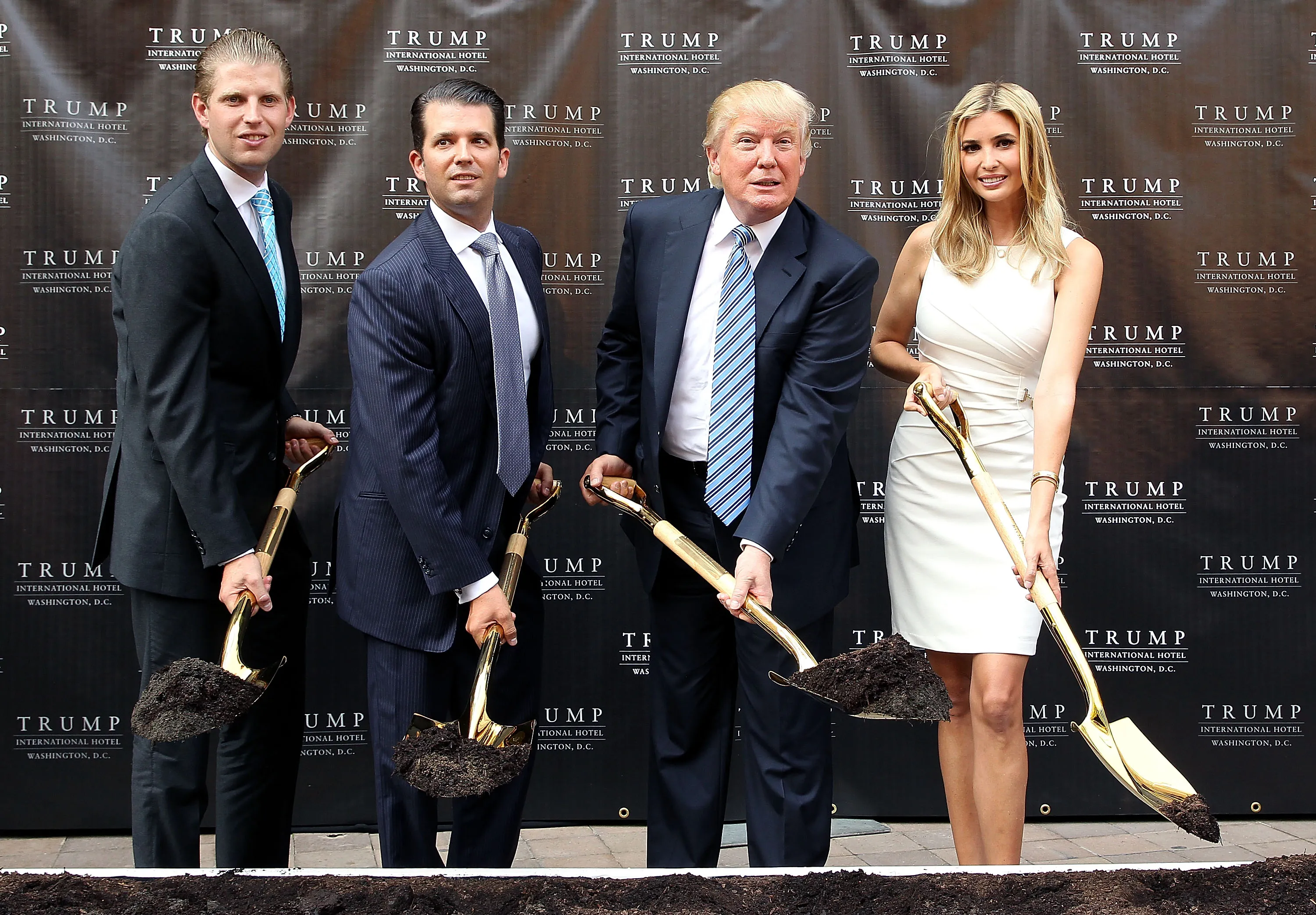 From left to right: Eric Trump, Donald Trump Jr., Donald Trump, and Ivanka Trump break ground at the Trump International Hotel Washington, D.C. in 2014.