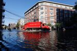 A sanitation truck drives through a flooded street in Hoboken the morning after remnants of Hurricane Ida drenched the New York City and New Jersey area in 2021.
