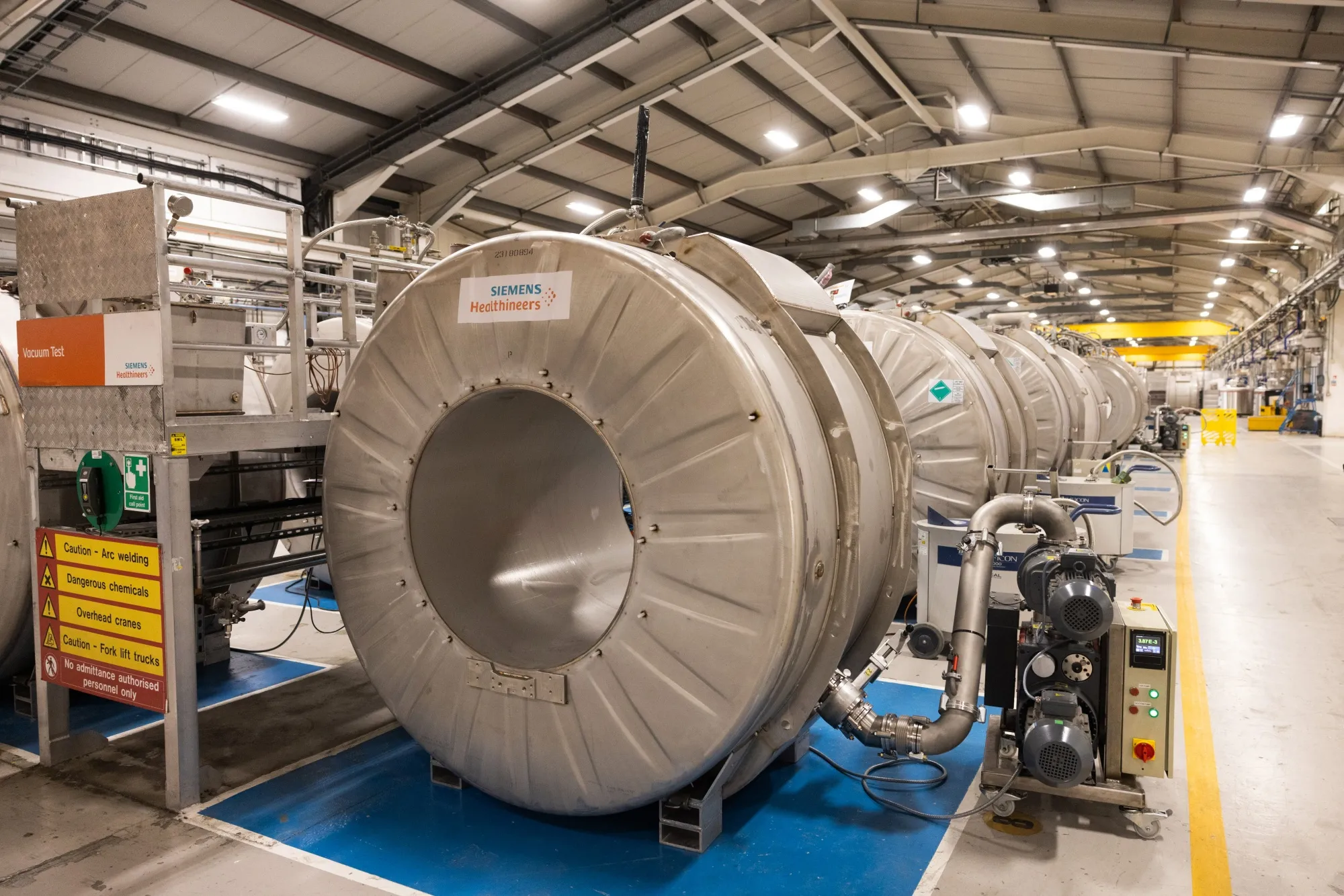 Magnetic Resonance Imaging (MRI) scanners on the manufacturing production line at the Siemens Healthineers factory near Oxford, UK.