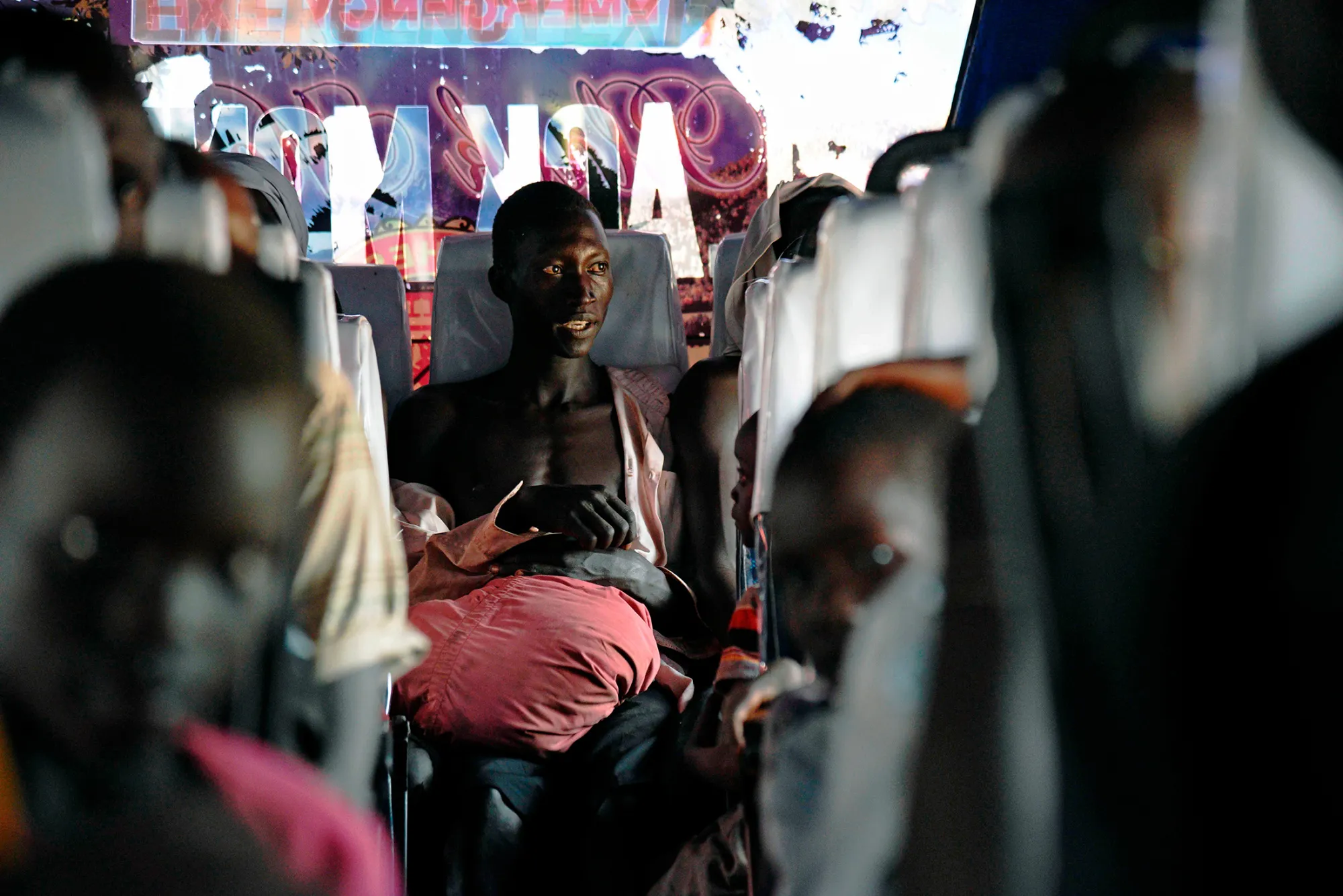 Newly arrived refugees from South Sudan aboard a bus at the Ngomoromo border post on April 11.
