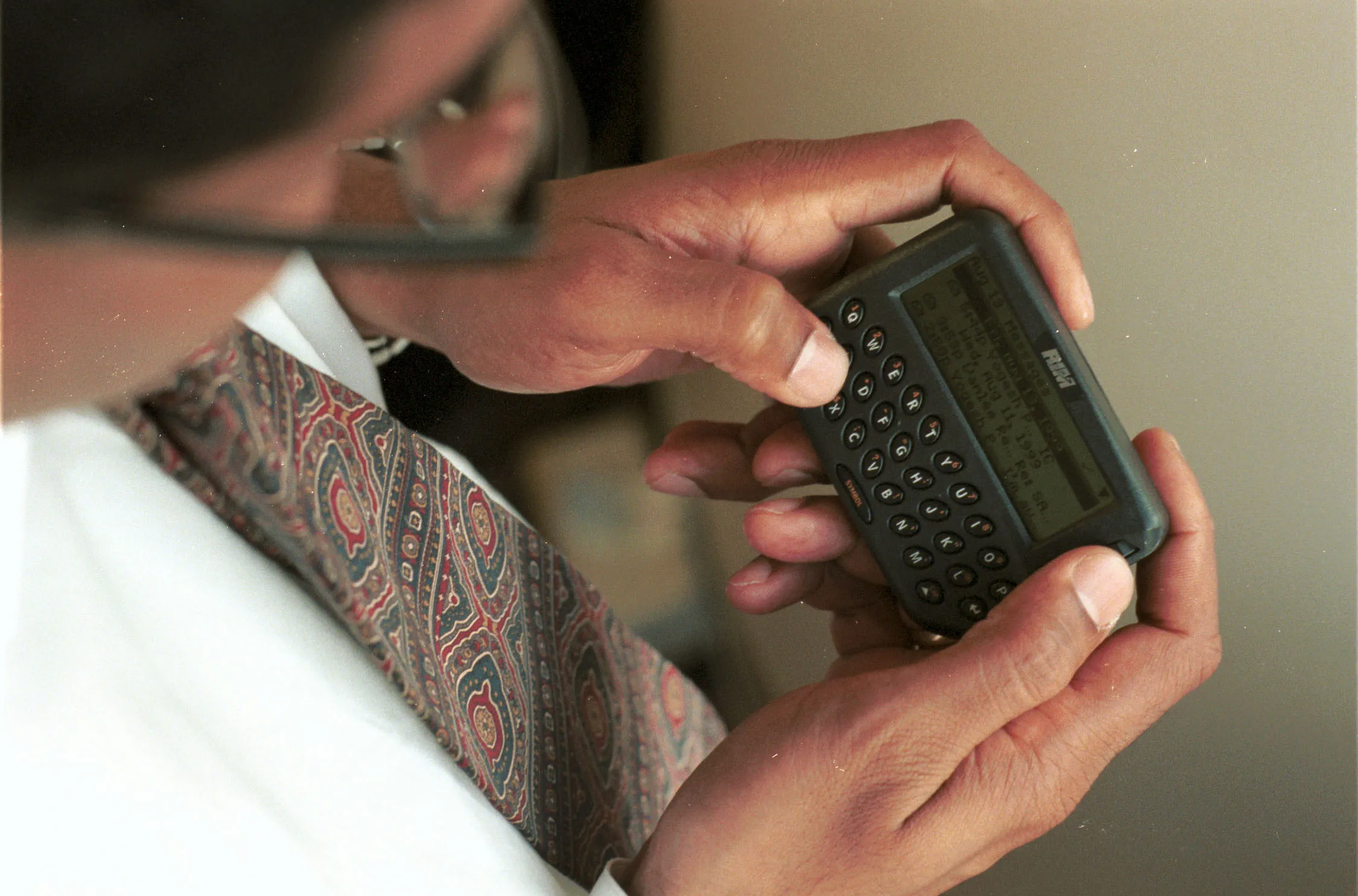 A text message is sent on a pager.&nbsp;