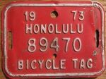 A vintage 1973 Honolulu bicycle license plate.