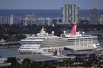 The Carnival Conquest cruise ship sits docked at port on Oct. 20, 2021, in Miami. Long-battered shares of Carnival Corp. jumped more than 12% Friday, June 24, 2022, as the cruise line owner reported a big increase in revenue, occupancy levels, and bookings for future trips. However, the company posted a $1.83 billion second-quarter loss and said the effects of the pandemic and higher fuel prices will lead to another loss in the third quarter. (AP Photo/Rebecca Blackwell, File)