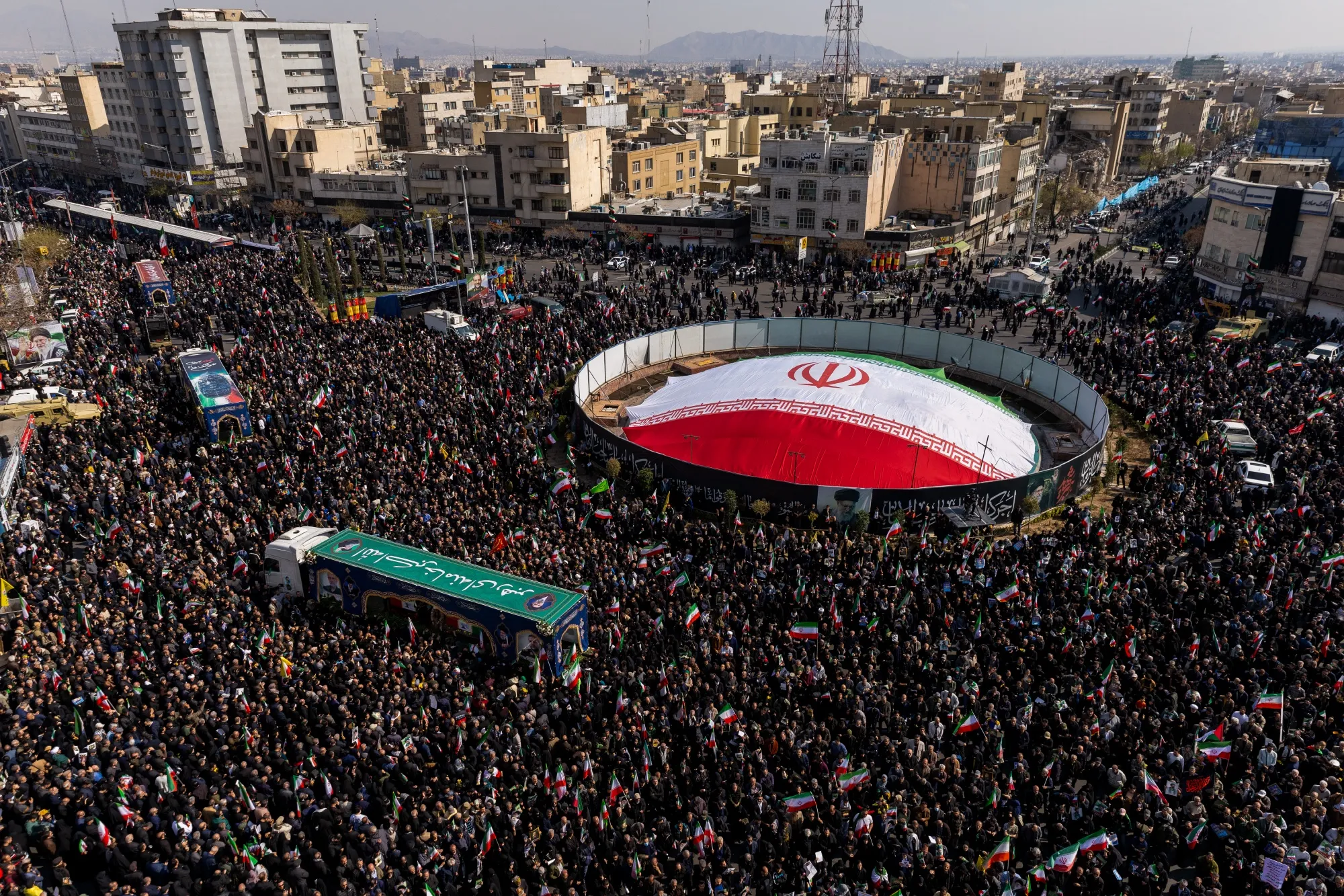 Crowds gather during a joint funeral held for Ali Larijani and 84 sailors from an Iranian Navy frigate in Tehran on March 18.