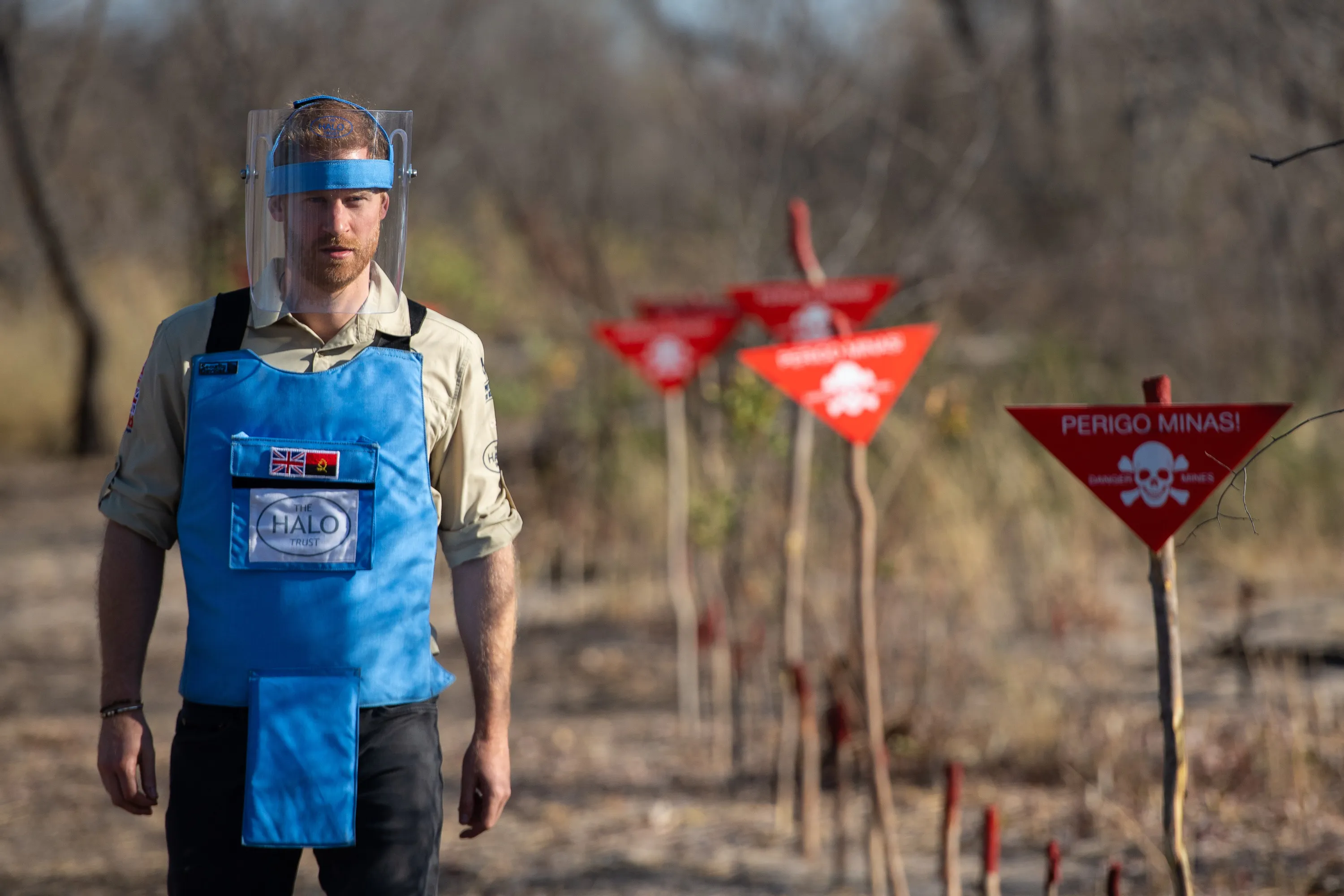 Prince Harry, Duke of Sussex walks through a minefield in Dirico, Angola, during a visit to see the work of landmine clearance charity the Halo Trust during his tour of Africa.