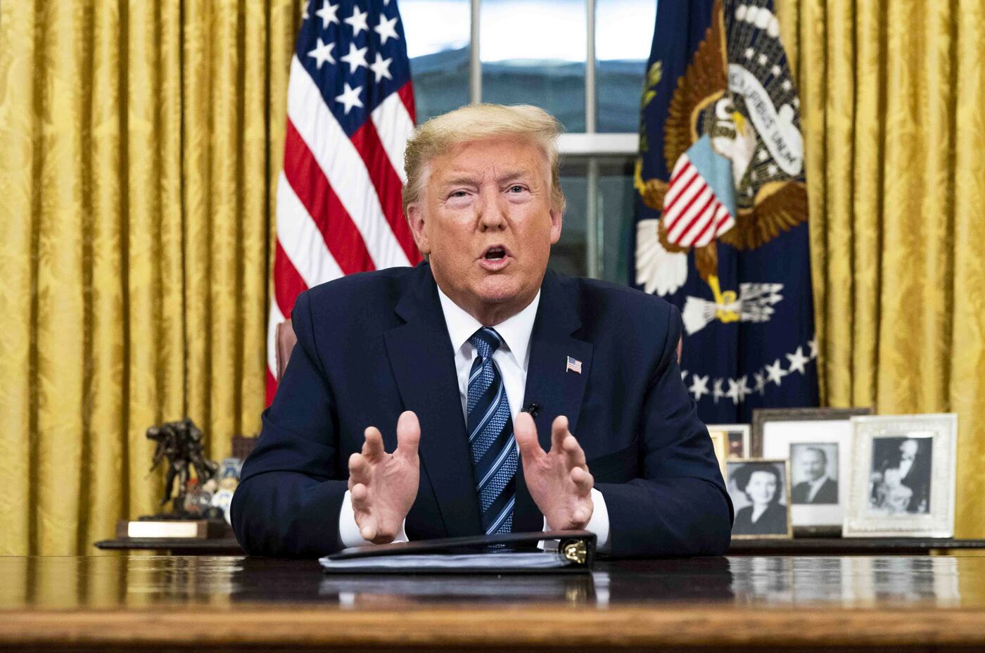 President Trump speaks during a televised address in the Oval Office on March 11.