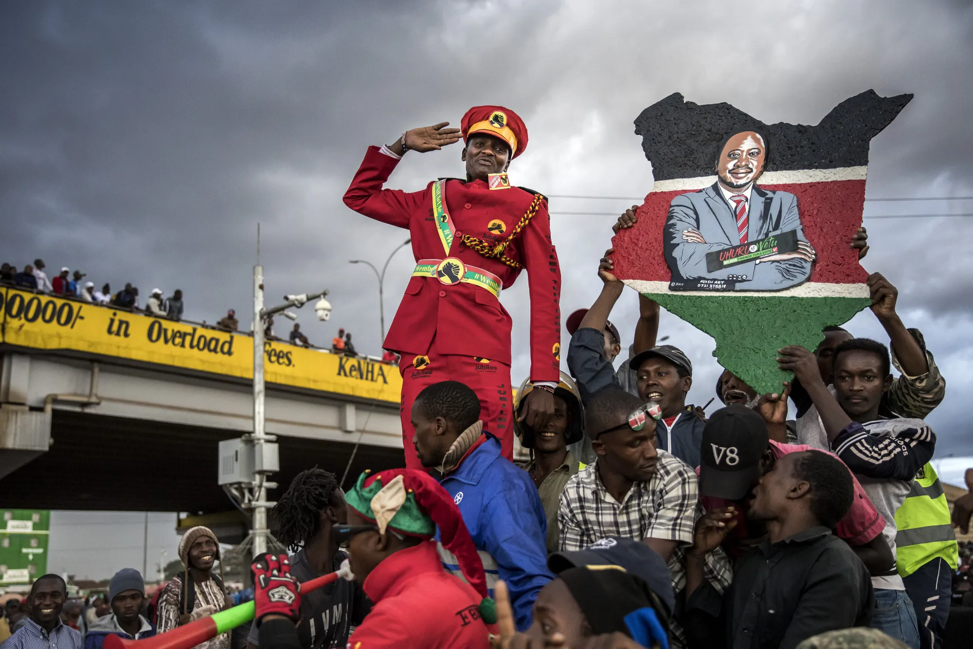 A supporter of Kenya's president Uhuru Kenyatta salutes from the crowd in Nairobi.