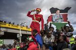 A supporter of Kenya's president Uhuru Kenyatta salutes from the crowd in Nairobi.