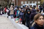 Displaced Ukrainians wait outside an immigration office in Brussels, Belgium, on March 14.
