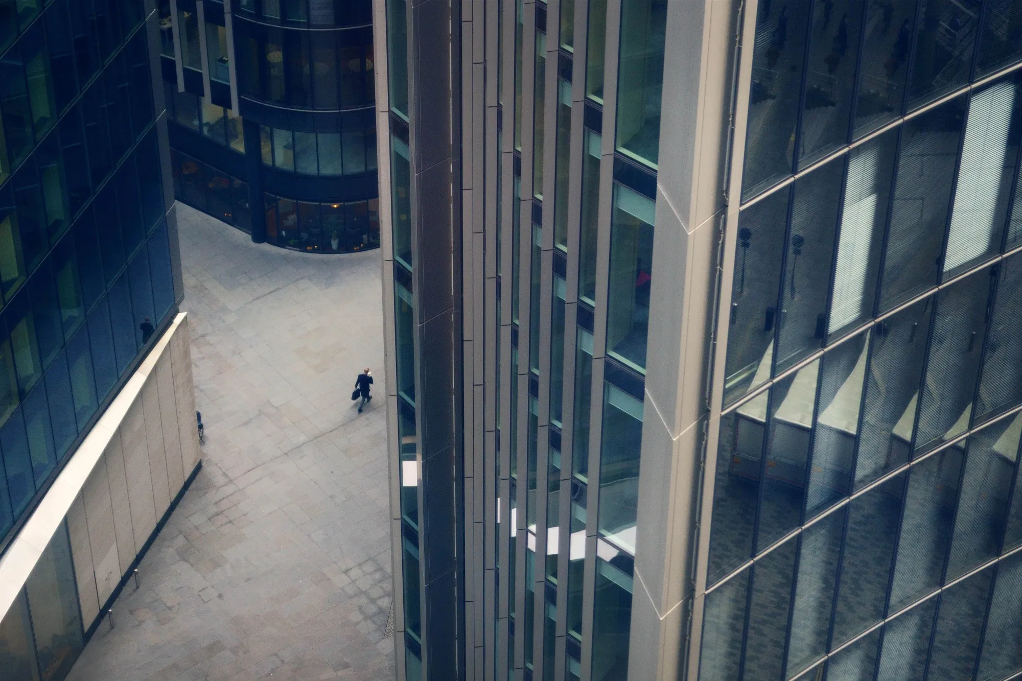 A man walks through the financial district of London.