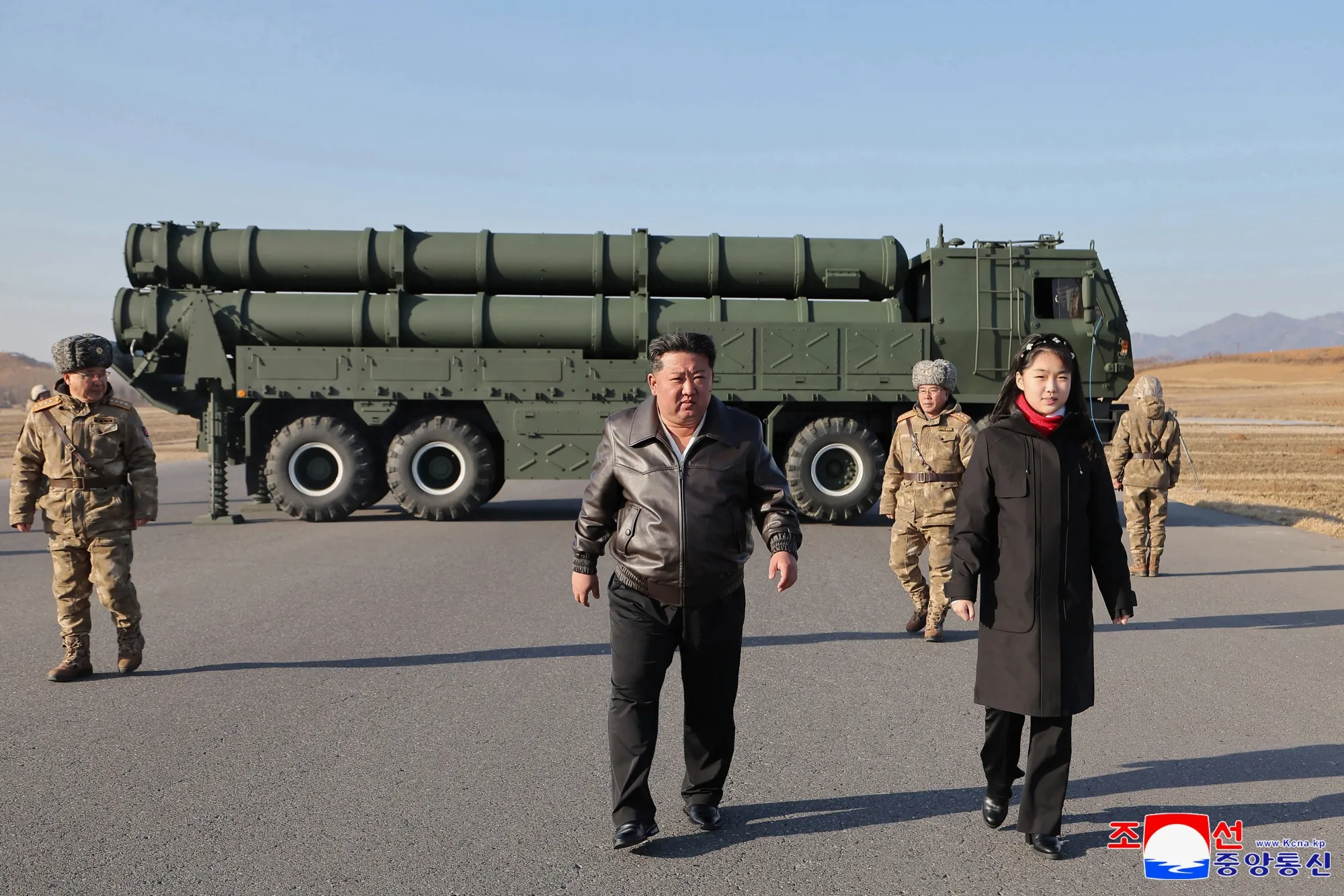 In this photo provided by the North Korean government, Kim Jong Un and his daughter inspect test-firing of ballistic missiles on Jan. 26.