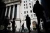 The silhouettes of pedestrian are seen walking past the New York Stock Exchange (NYSE) stands in New York, U.S., on Monday, May 9, 2016. U.S. stocks fluctuated, after the S&P 500 capped a second straight weekly retreat, amid declines in oil while investors awaited a final batch of earnings reports and further clues on the health of the economy.