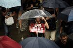 TOPSHOT - Protesters walk along a street during a rally in Hong Kong on August 18, 2019, in the latest opposition to a planned extradition law that has since morphed into a wider call for democratic rights in the semi-autonomous city.