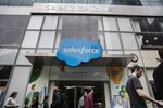 Pedestrians pass in front of the Salesforce Tower in New York.