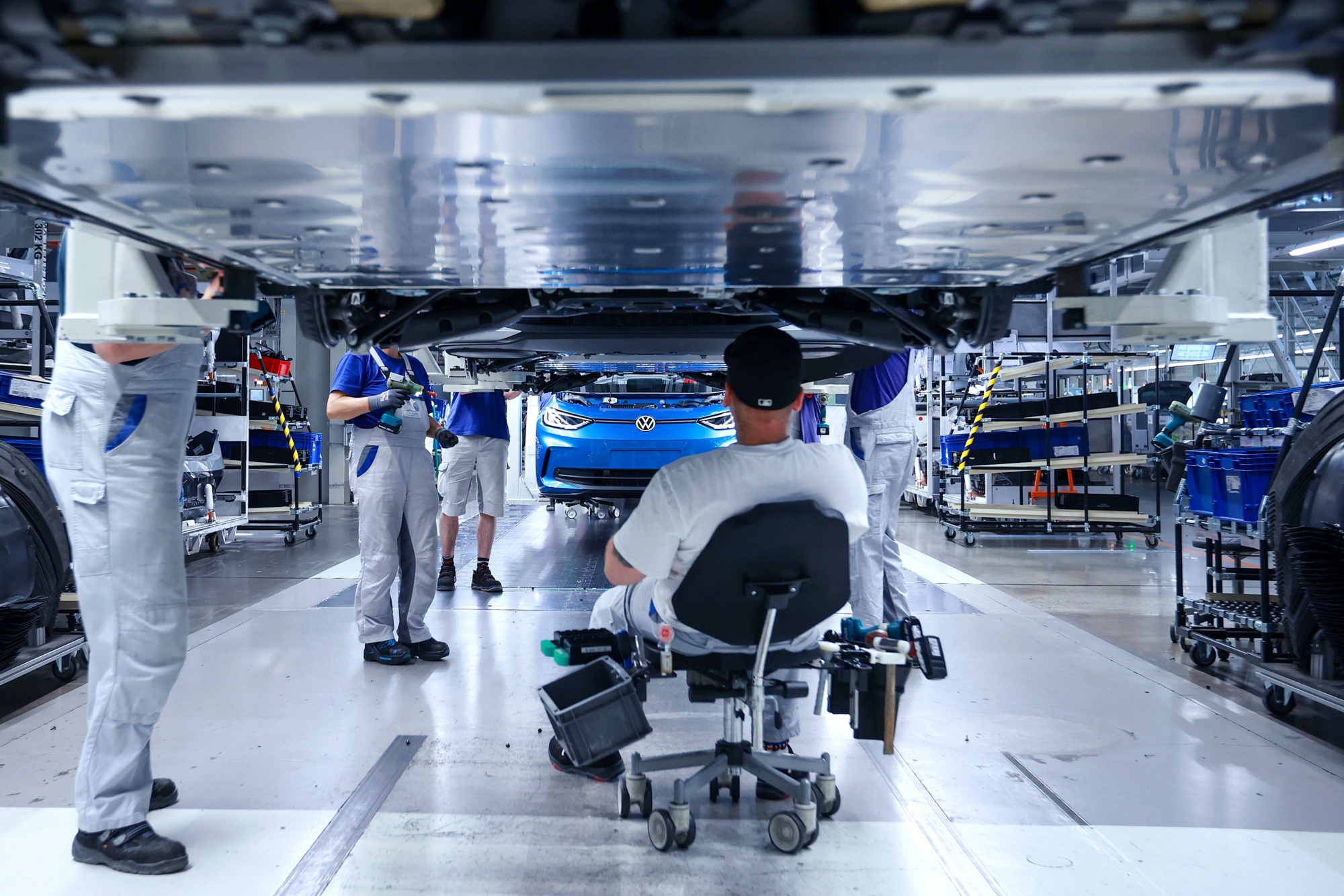 Employees work on the assembly line at the Volkswagen plant in Zwickau.