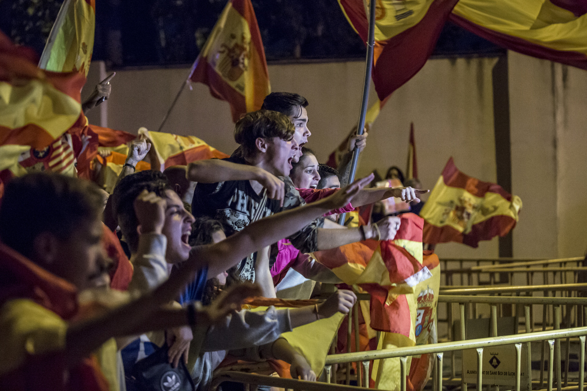 Anti-separatist demonstrators in support of the Spanish National Police and Civil Guard wave Spanish national flags on Oct. 5, 2017.