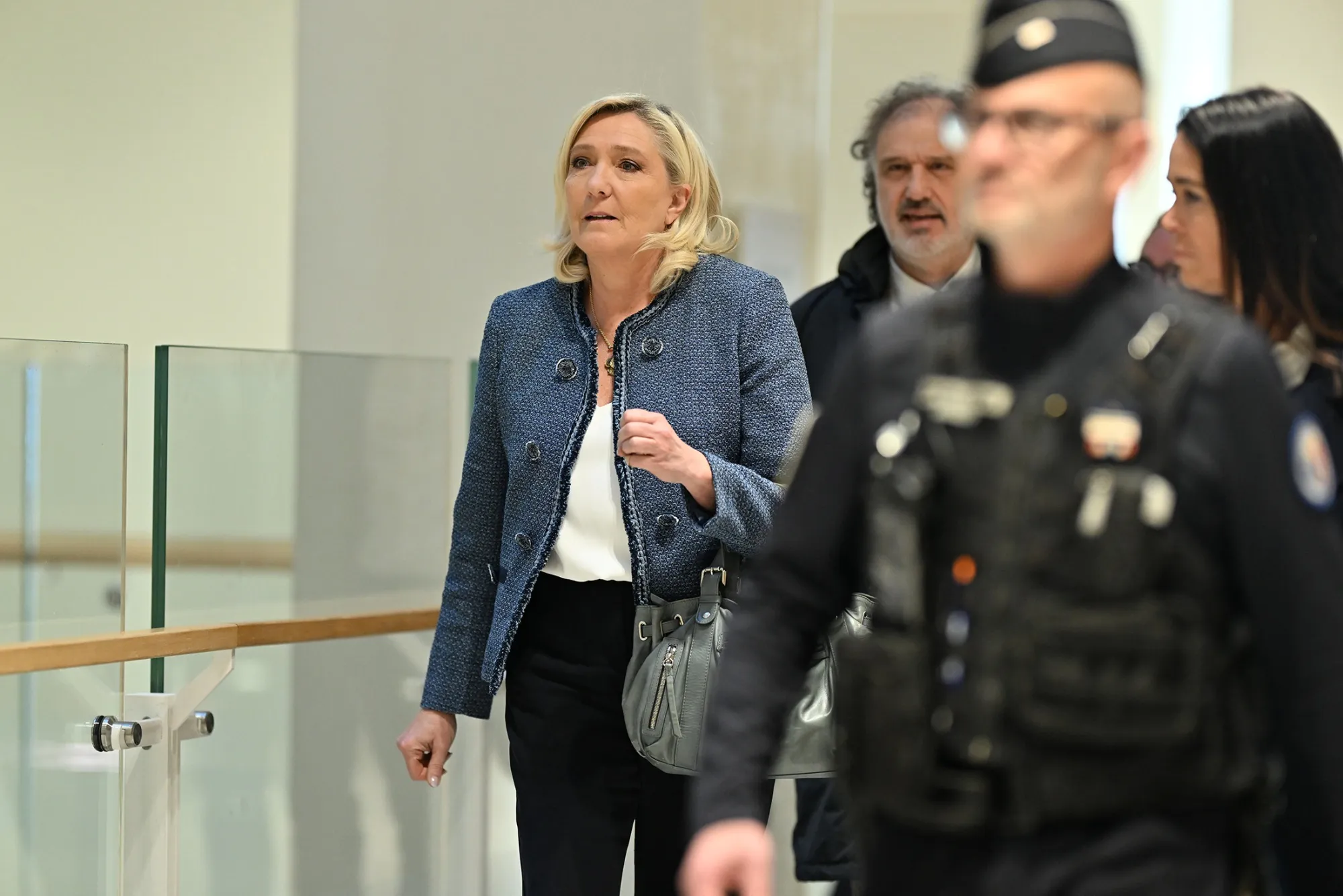 Lawyer Rodolphe Bosselut follows Marine Le Pen at court in Paris on March 31.