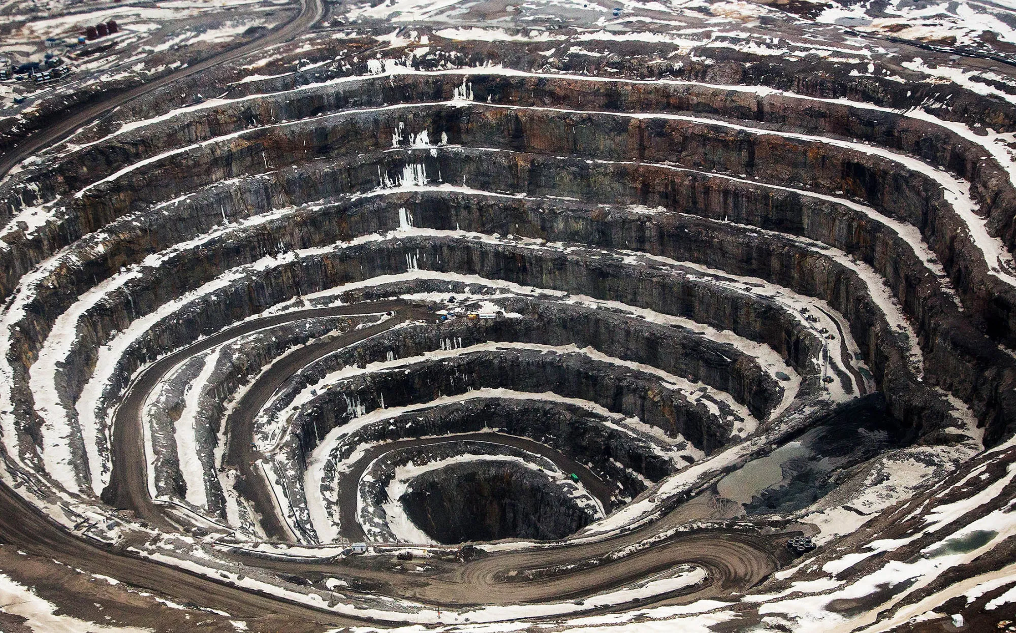 The open pit stands at the Diavik Diamond Mine, owned by Rio Tinto Plc and Dominion Diamond Corp., in the North Slave Region of the Northwest Territories, Canada, on Monday, May 2, 2016. Since the Diavik mine began operating in 2003, it has produced more than 90 million carats of diamonds, including the 187.7 carat Foxfire.
